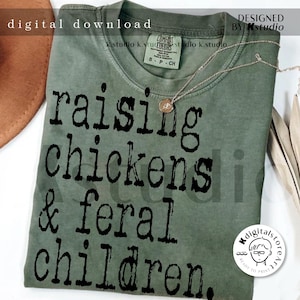 May include: A green t-shirt with the text "raising chickens & feral children." printed in black.
