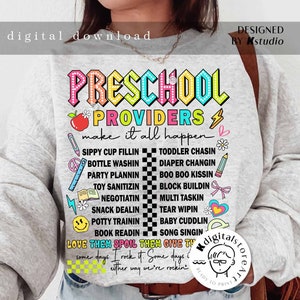 May include: A gray sweatshirt with the text "PRESCHOOL PROVIDERS make it all happen" in rainbow colors. The text is surrounded by various colorful icons and illustrations related to preschool activities, such as sippy cups, diapers, and books. The text "LOVE THEM SPOIL THEM GIVE THEM" is also included in the design.