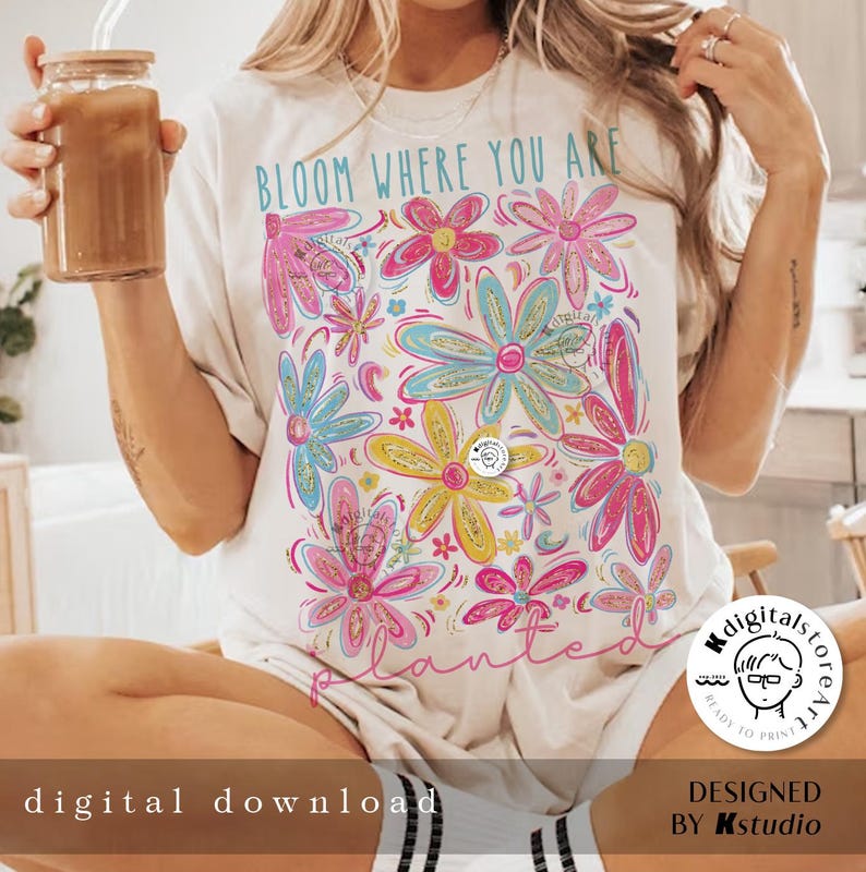 May include: White t-shirt with a floral design and the text "Bloom Where You Are Planted".