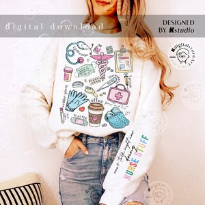 May include: White sweatshirt with a colourful graphic design of medical supplies and the text "can't talk right now doing NURSE STUFF".