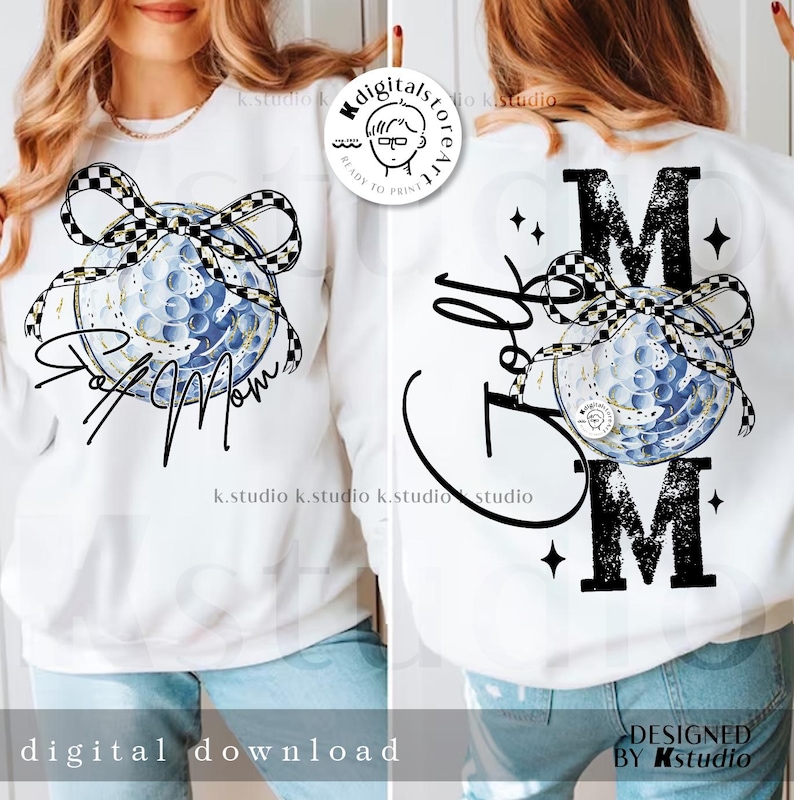 May include: White sweatshirt featuring a golf ball design with a black and white checkered bow. The front says "Golf Mom" in script, and the back says "Golf Mom" with the letter "M" in bold. The design includes stars and musical notes.