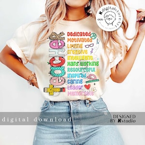 May include: A white t-shirt with a colorful graphic design that says "Teacher" with a list of positive words describing the profession, including "dedicated", "motivated", "creative", "intelligent", "hardworking", "resourceful", "inspiring", "caring", "leader", and "memorable".