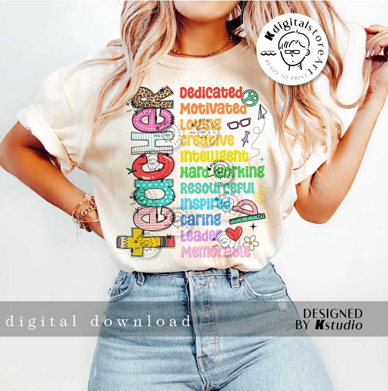 May include: A white t-shirt with a colorful graphic design that says "Teacher" with a list of positive words describing the profession, including "dedicated", "motivated", "creative", "intelligent", "hardworking", "resourceful", "inspiring", "caring", "leader", and "memorable".