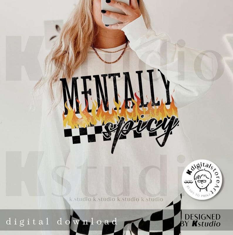 May include: White long-sleeve shirt with the text "MENTALLY spicy" in black lettering with flames and a checkered pattern.