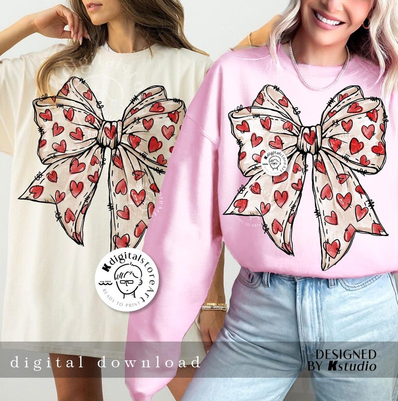 May include: Two women wearing pink and white sweatshirts with a large red and white heart-shaped bow design. The text "MdigitalstoreArt" is on the white sweatshirt. The text "DESIGNED BY Kstudio" is on the pink sweatshirt.