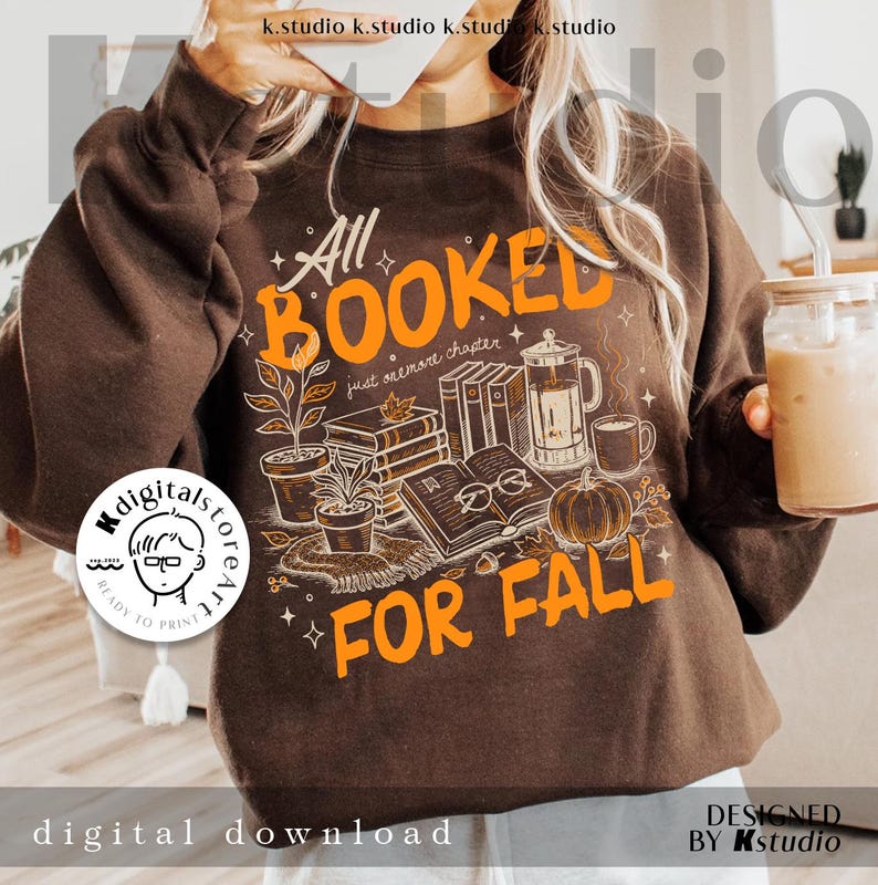 May include: A brown sweatshirt with the text "All Booked For Fall" in orange. The graphic includes books, a pumpkin, coffee, and plants. The design is a digital download.