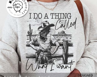 May include: A gray sweatshirt with a black and white graphic design of a woman wearing a cowboy hat and the text "I do a thing called what I want".
