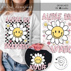 May include: A white long-sleeve shirt with a pink and black checkered background, a white daisy with a yellow smiley face, and the text "A Little Bit Dramatic". A black t-shirt with a white daisy with a yellow smiley face and the text "Kid Life" in pink.