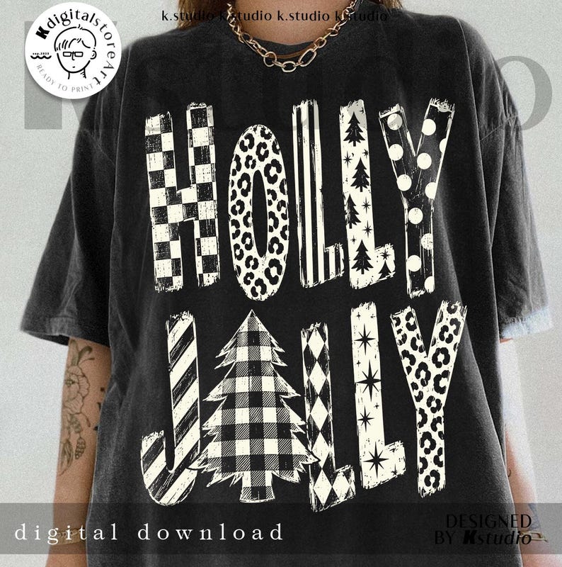 May include: A black short-sleeve t-shirt featuring the white text HOLLY JOLLY. The letters are filled with various patterns including checkerboard, leopard print, stripes, Christmas trees, polka dots, and stars, with a buffalo plaid tree.