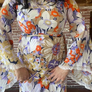 jaw dropping vintage 1960s purple and orange large scale floral angel sleeve maxi hostess dress