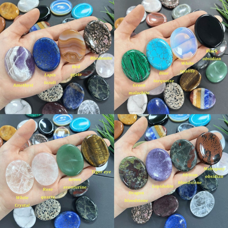 K&ouml;nnte beinhalten: Sortiment polierter ovaler Steine in verschiedenen Farben und Texturen, darunter Amethyst, Lapislazuli, roter Achat, Rhodonit, gr&uuml;ner Malachit, blauer T&uuml;rkis, wei&szlig;er Opalit, schwarzer Obsidian, Tigerauge, gr&uuml;ner Aventurin, Rosenquarz, wei&szlig;er Kristall, Drachenblutstein, Lepidolith, afrikanischer Blutstein und Mahagoni-Obsidian.