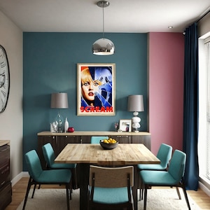 May include: A dining room with a teal blue wall, a pink wall, and a dark wood table with six chairs. A poster with the word "SCREAM" in red letters is hanging on the teal wall. The poster features a woman's face with a broken glass effect.