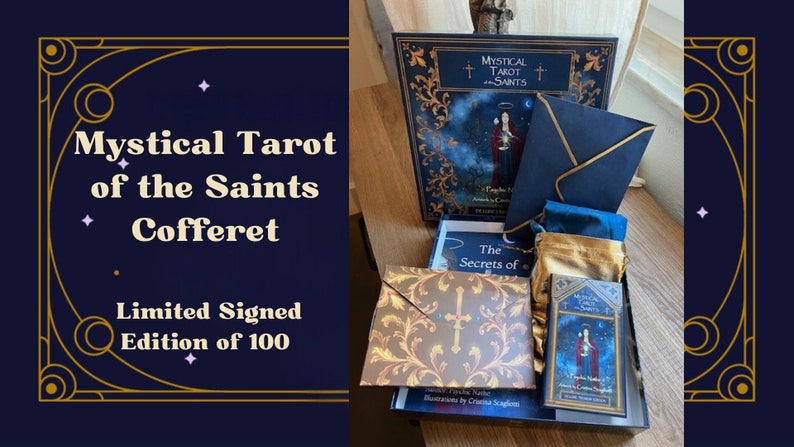 May include: A navy blue box with gold accents contains a tarot deck, a guidebook, and other accessories. The box is labeled "Mystical Tarot of the Saints Cofferet, Limited Signed Edition of 100".