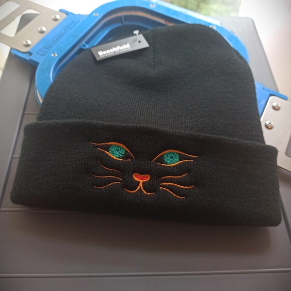 Cat Winter Beanie hat with embroidered mysterious cat  eyes. Fine and comfortable quality .Made in the UK.