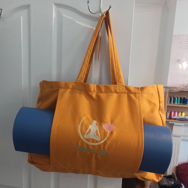A Yoga bag themed with a yogi practicing and a floral Embroidered classy companion for your way of life. UK made, large tote bag