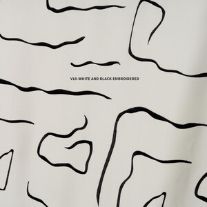 Elegant embroidered linen blackout curtains, perfect for high-ceiling spaces. Double & triple pleat available. Thermal insulated & noise-reducing design.