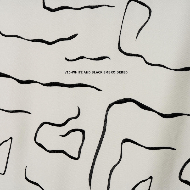 Elegant embroidered linen blackout curtains, perfect for high-ceiling spaces. Double & triple pleat available. Thermal insulated & noise-reducing design.