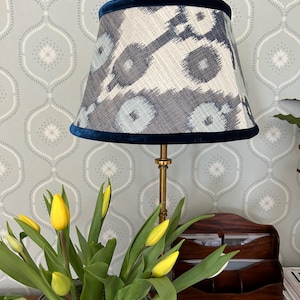 Geometric blue lampshade with velvet trim