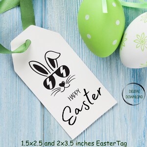 May include: A white tag with a black and white illustration of a bunny wearing sunglasses. The text "Happy Easter" is written in black cursive script below the bunny. The tag is 1.5x2.5 and 2x3.5 inches.