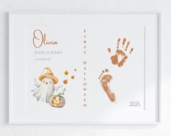 May include: A white framed print with an orange and white ghost illustration, a handprint, a footprint, and the text "Olivia, Jessica Jones, 7 months old, First Halloween 2025".