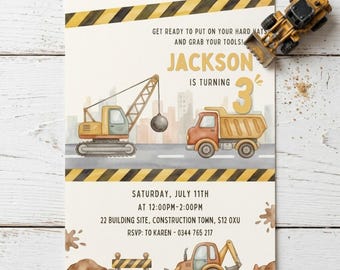 May include: A construction-themed birthday invitation with the name "Jackson" and the number "3". The design features illustrations of construction vehicles like a crane, dump truck, and excavator. The invitation includes event details and the text "Get ready to put on your hard hats and grab your tools!"