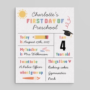 May include: A colorful preschool sign with the text "Charlotte's First Day of Preschool." It includes the date, teacher's name, age, and aspirations. The sign also lists favorite things like baking cakes and gymnastics.