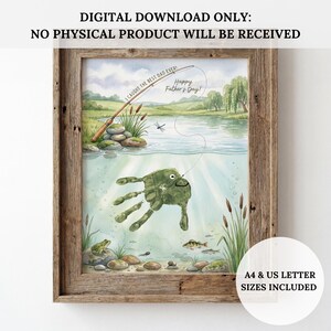 May include: Framed watercolor print with a fishing theme. The artwork features a handprint transformed into a fish, a fishing rod, and the text "I caught the best Dad ever! Happy Father's Day!". Includes A4 & US Letter sizes.