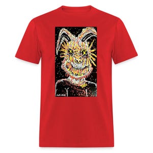 May include: Red t-shirt with a black and white graphic of a cartoon bunny with yellow eyes and a yellow smile. The bunny has a black background and the text "TOPE" is written on the bunny's chest.