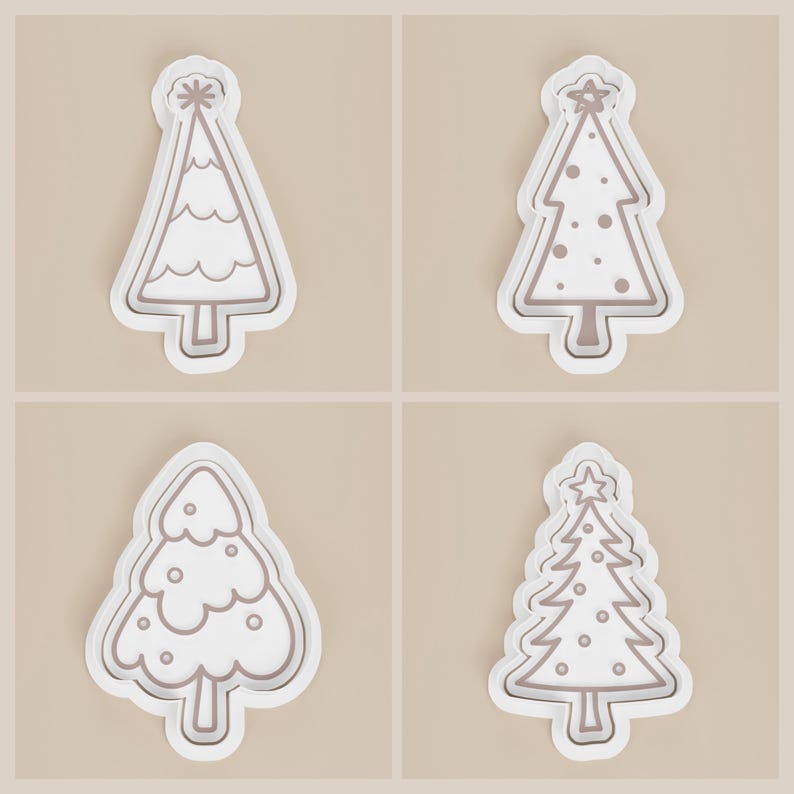 May include: Four white Christmas tree-shaped cookie cutters with brown outlines. Each cutter has a different design, including wavy lines, dots, and star accents. The cutters are set against a neutral background.