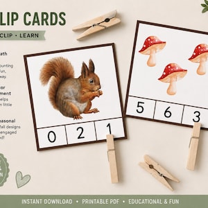 Peut inclure: Cartes à pince automnales avec le texte FALL CLIP CARDS, COUNT, CLIP, LEARN et COUNT IT, CLIP IT, LEARN IT. Deux cartes carrées présentent un écureuil brun et trois champignons rouges avec les chiffres 0, 2, 1 et 5, 6, 3. Pinces en bois incluses.