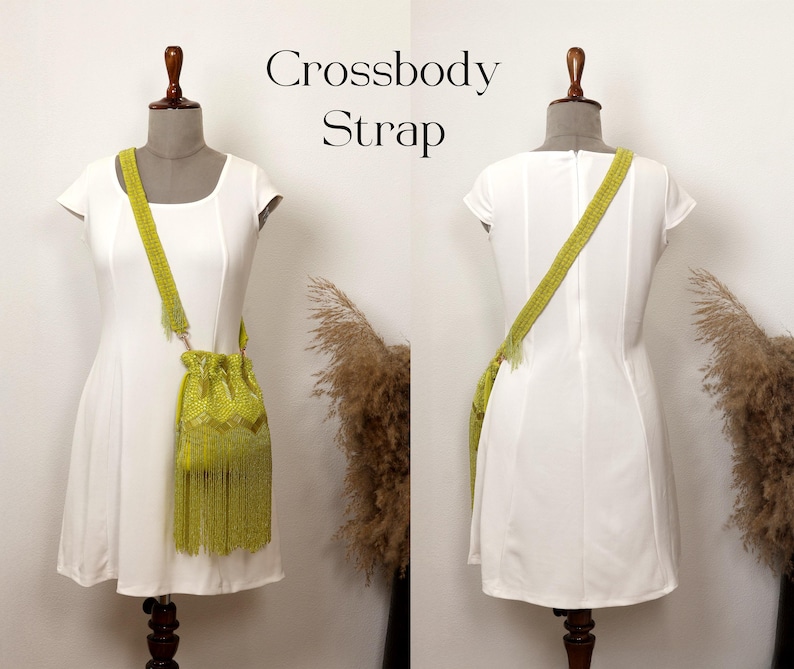 May include: A lime green drawstring bag with a long fringe and a matching crossbody strap, displayed on a mannequin wearing a white dress. The text Crossbody Strap is visible in the center. The bag features a textured, woven pattern.