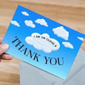 May include: A blue thank you card with a white cloud that says "I am on cloud 9".
