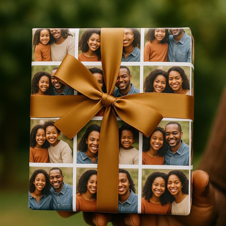 May include: A wrapped gift with a custom photo collage on the wrapping paper. The paper features a grid of family photos. A large, golden-brown satin ribbon and bow adorn the gift, held by a person with brown skin.