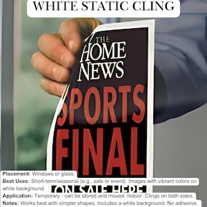 May include: White static cling with the text "THE HOME NEWS SPORTS FINAL" printed on it. The cling is being applied to a window or glass surface.