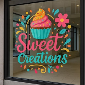 May include: A window decal featuring a colorful cupcake with pink frosting and sprinkles, teal liner, and a yellow and orange swirl on top. The words "Sweet Creations" are in pink and teal.