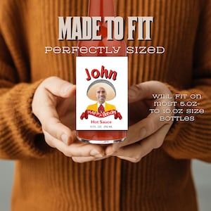 May include: A personalised hot sauce bottle label with a photo of a person wearing a sombrero and the text "John Happy Birthday Hot Sauce 10 FL OZ - 296 ML". The label is designed to fit most 5 oz to 10 oz size bottles.