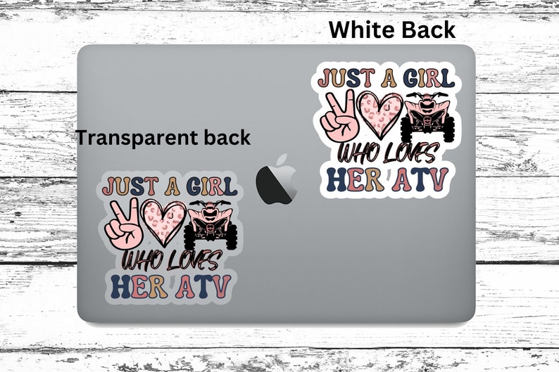 May include: Two stickers on a laptop, both featuring a peace sign, a heart with a leopard print, an ATV, and the text "Just a girl who loves her ATV".