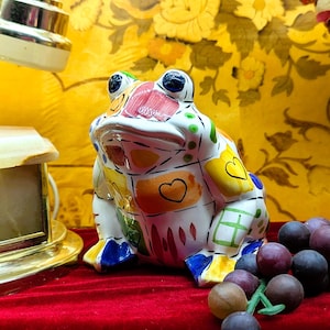 May include: A set of three ceramic mugs with a speckled, matte finish. The mugs are in shades of cream, light gray, and dark gray. Each mug has a simple, minimalist design, perfect for coffee or tea.