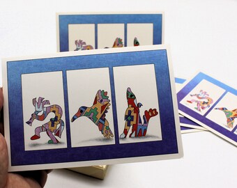 May include: Three colorful cards with a blue border and white interior. Each card features a different stylized animal design in a geometric pattern. The animals are a bird, a deer, and a fish.