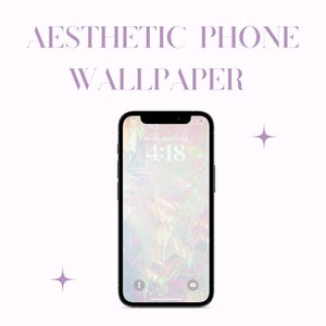 以下が含まれることがあります： 白い背景に黒いスマートフォンがあり、画面には花のぼやけた画像が表示されています。時間は4:18です。スマートフォンには白い通知アイコンと黒いカメラアイコンがあります。