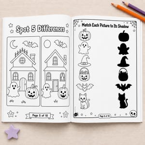 May include: An open activity book featuring two pages of Halloween-themed puzzles. The left page is titled Spot 5 Differences and shows two haunted houses with ghosts and pumpkins. The right page is titled Match Each Picture to Its Shadow.