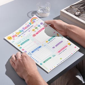 May include: A daily planner sheet titled My Daily Focus Plan ADHD + Autism Executive Function Planner. The page features colourful sections for Top 3 Priorities, Brain Dump, My Schedule, Start Here, I Need Help With, and Celebrate a Win.
