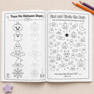 May include: An open activity book featuring two pages of black and white Halloween-themed line art. The left page is titled Trace the Halloween Shapes, and the right page is titled Find and Circle the Bats, with instructions and various icons.