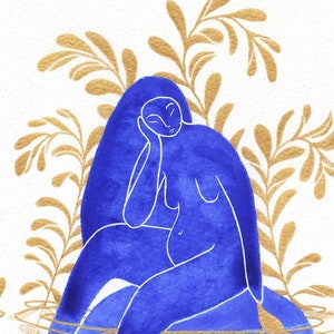 Blue and gold watercolor painting of a pregnant woman sitting peacefully amid plants