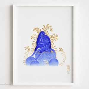 Blue and gold watercolor painting of a pregnant woman sitting peacefully amid plants