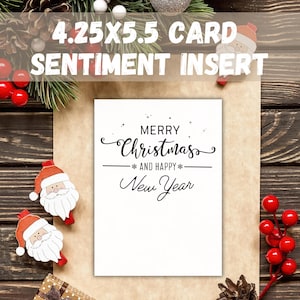 May include: A white Christmas card with the text "Merry Christmas and Happy New Year" in elegant script. The card is 4.25 x 5.5 inches. The image is decorated with festive elements like Santa Claus ornaments, red berries, and pine needles.
