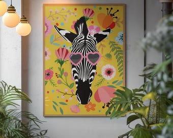 May include: A framed art print featuring a zebra head wearing pink heart-shaped sunglasses. The zebra is set against a yellow background filled with colorful flowers. The artwork is in a wooden frame.
