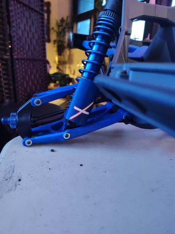 Paragamolle E Paracolpi Per Traxxas X-MAXX® - Set Di 4 Protezioni Per Molle E Ammortizzatori
