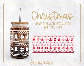 May include: A clear glass can-shaped tumbler with a wooden lid and a silver straw. The tumbler features a white pixelated Christmas tree and snowflake design. The words "Christmas" and "LIBBEY GLASS CAN 16 OZ & 20 OZ" are also visible.