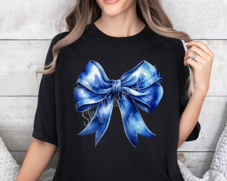 May include: A black t-shirt with a large blue watercolor bow design.